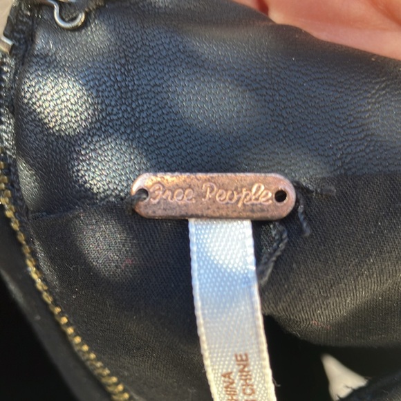 Free People faux leather mini skirt.  Fully lined.  Zips in the back.  Cute on! - Picture 7 of 9